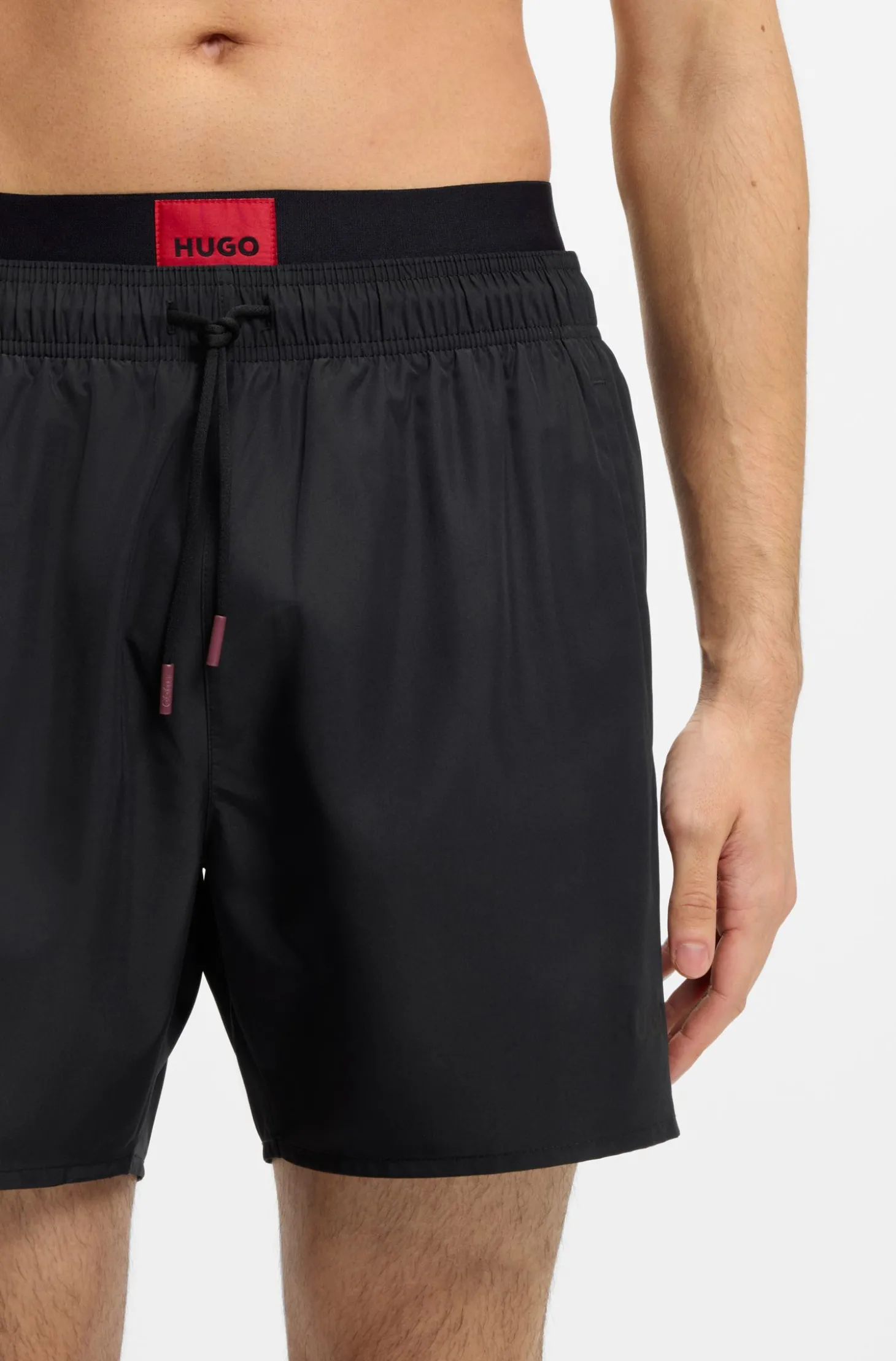 Badeshorts mit doppeltem Bund und Logo-Details