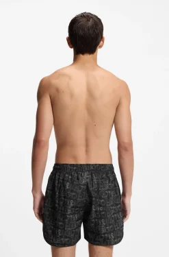 Badeshorts mit saisonalem Print und abgerundetem Saum