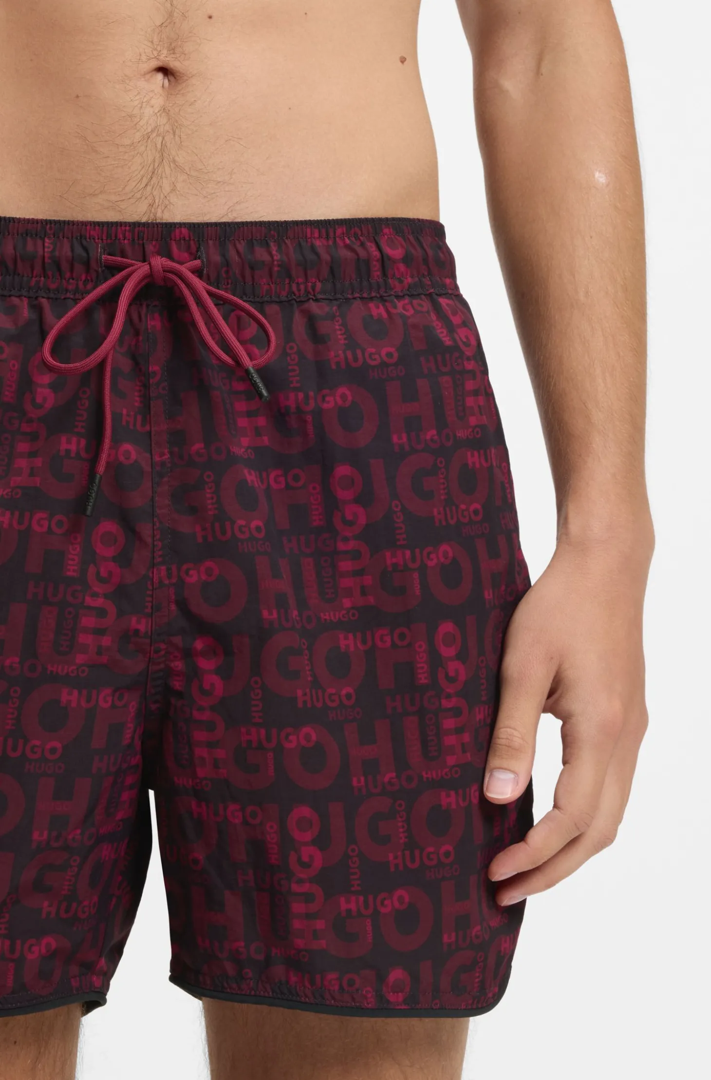 Badeshorts mit saisonalem Print und abgerundetem Saum