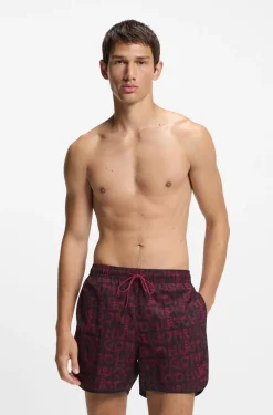 Badeshorts mit saisonalem Print und abgerundetem Saum