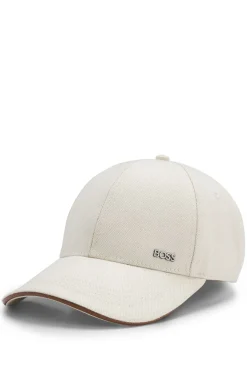 Cap aus Baumwoll-Canvas mit Lederbesatz