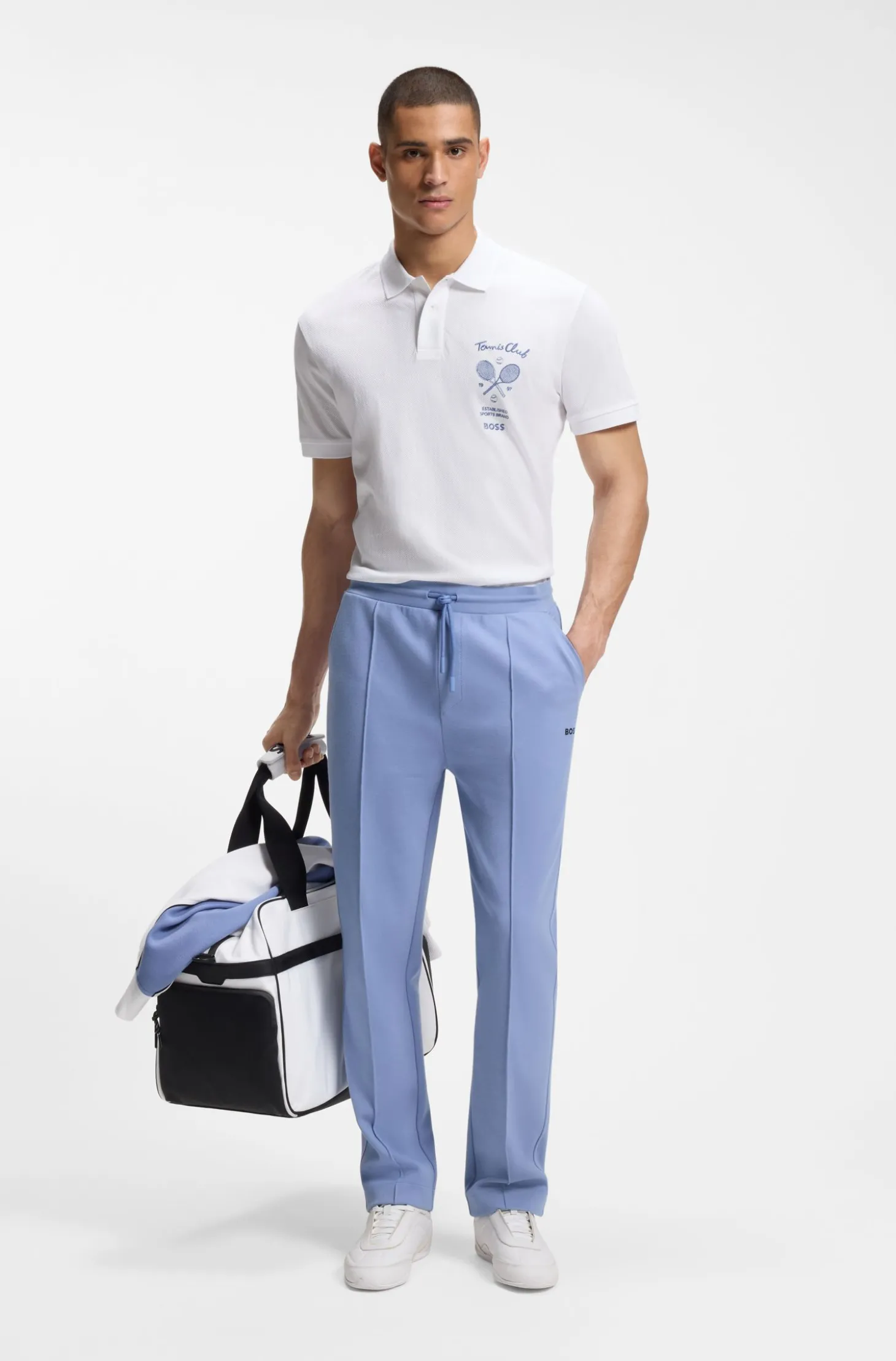 Poloshirt aus Baumwolle in Mesh-Optik mit gesticktem Artwork