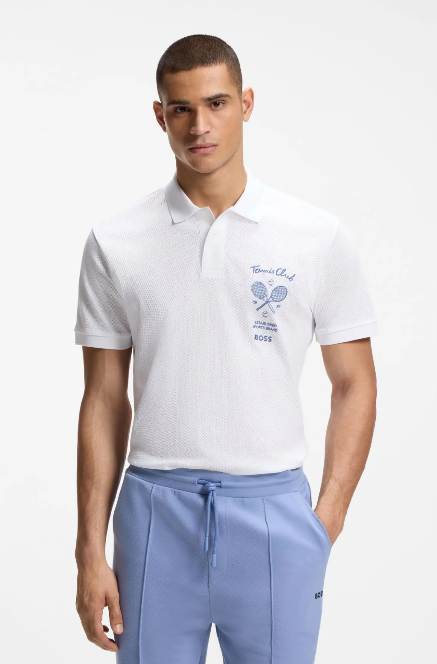 Poloshirt aus Baumwolle in Mesh-Optik mit gesticktem Artwork