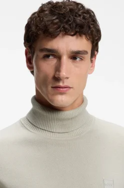 Rollkragenpullover aus Baumwoll-Mix mit Kaschmir und Logo-Aufnäher