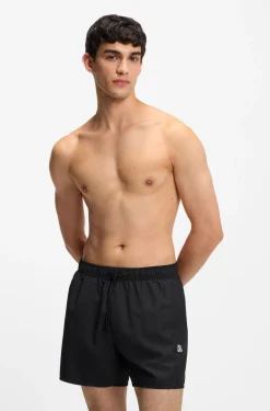 Set mit Badeshorts, Badetuch und Tasche