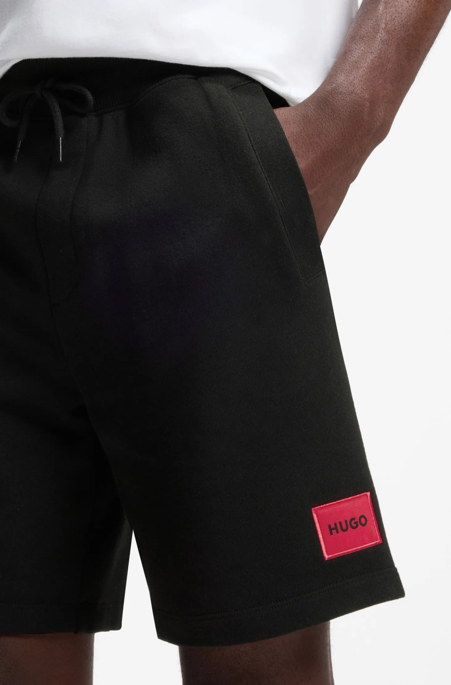 Shorts aus Baumwoll-Terry mit rotem Logo-Label