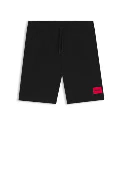 Shorts aus Baumwoll-Terry mit rotem Logo-Label