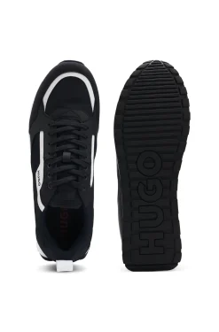 Sneakers aus verschiedenen Materialien mit Logo-Akzenten