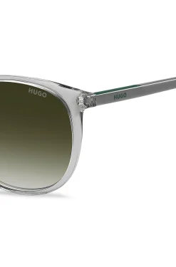 Transparent-graue Sonnenbrille mit grünem Logo